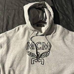 Brand new men’s MCM grey logo sweater. Size Medium